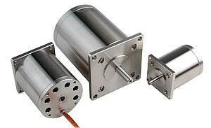 Motors modified for UHV applications: outgassing holes, polyimide-shielded braids, and clean stainless steel surface.